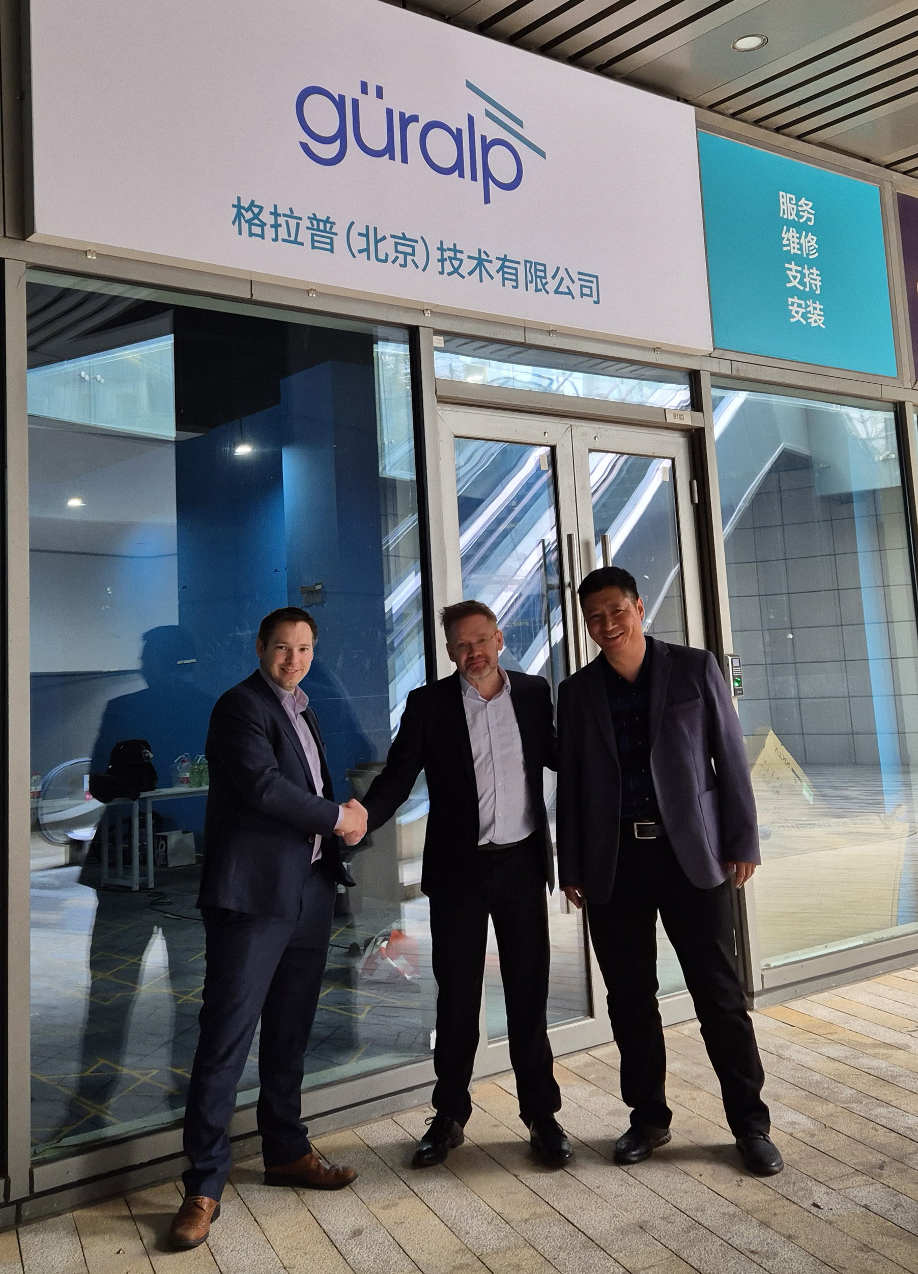 Neil Watkiss, Sean Goessen and Bin Lu outside Guralp's new service centre office Image